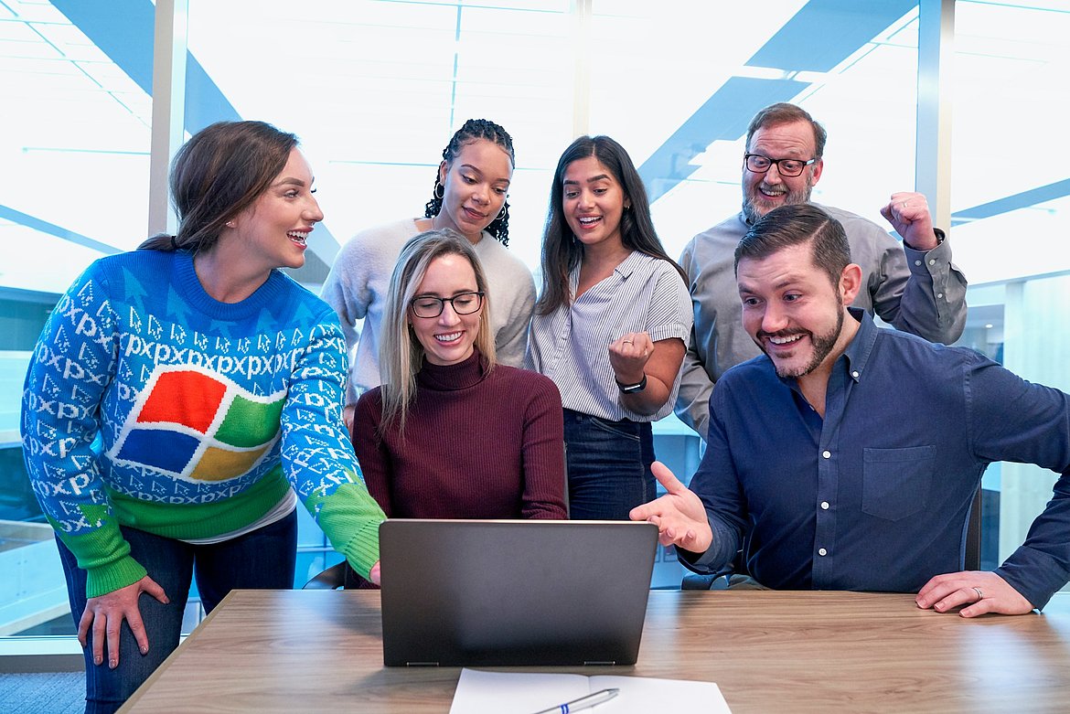 People in front of a computer