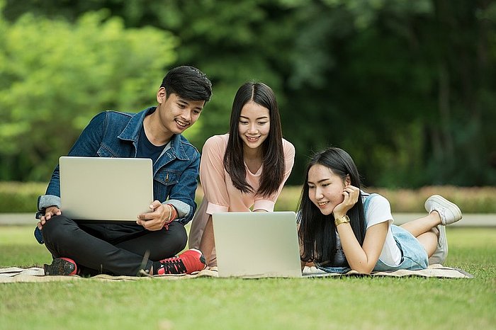 Photo three students studying